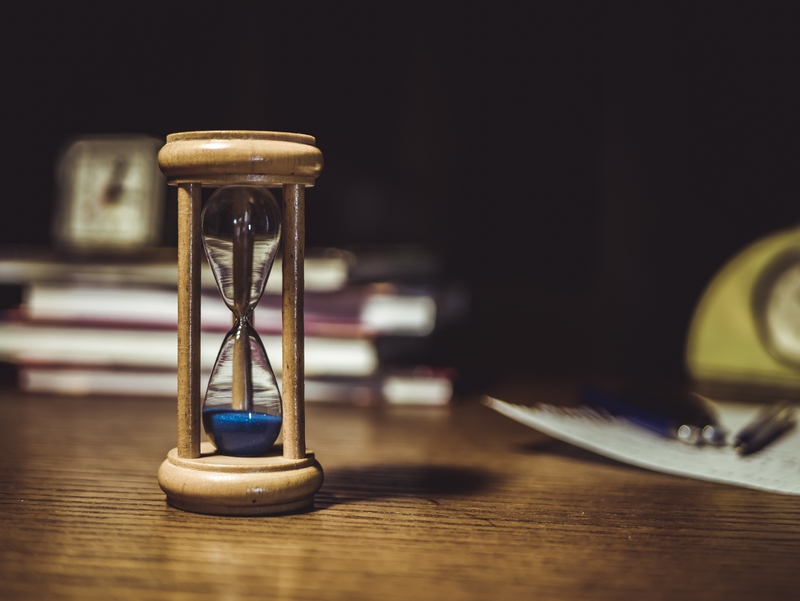 brown hourglass on brown wooden table 1178684